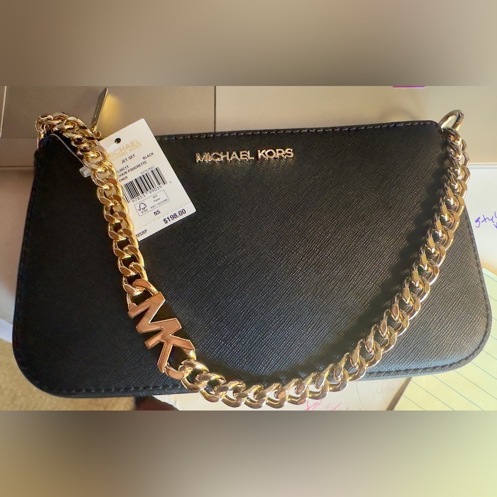 Michael Kors Jetset black leather small pouchette with MK on gold chain. NWT